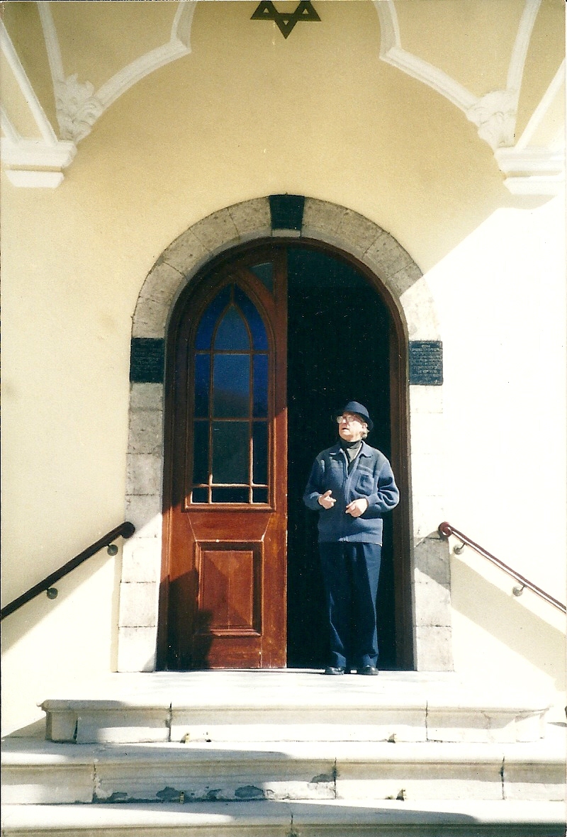 Hazzan Beniso standing at the entrance of the Nefusot Yehudah  Synagogue